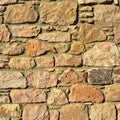 Sturdy beige and purple cut stone wall, seamless lined up