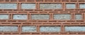 Sturdy beige and red cut stone wall, seamless lined up