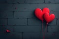 A sturdy brick wall features several vibrant red hearts beautifully painted upon its surface, creating an eyecatching contrast Royalty Free Stock Photo