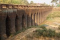 Sturdy corbeled arches of Angkor bridge,