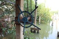 Sturdy and old steel reels are a mechanism for keeping boats under the house.