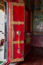 Decorated, red temple door at Thiksay Monastery near Leh, India