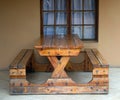 Sturdy wooden table with two seats attached