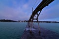 Sturgeon canal light and walkway across the frozen pier in Winter on the shipping canal to lake Michigan