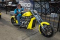 A byker A biker riding his chopper motorcycle during the annual Sturgis Motorcycle rally in the main street of the city of Sturgis Royalty Free Stock Photo