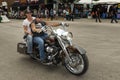 A byker riding his chopper motorcycle during the annual Sturgis Motorcycle rally in the main street of the city of Sturgis