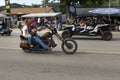 A byker riding his chopper motorcycle during the annual Sturgis Motorcycle rally in a street of the city of Sturgis Royalty Free Stock Photo