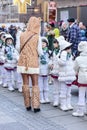 Baby majorettes listening at their wild like chaperon and at Car