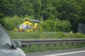 STUTTGART, GERMANY - June, 2016: A rescue helicopter on the Autobahn during an accident. Evacuation of victims.