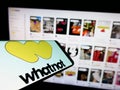 Mobile phone with logo of US e-commerce company Whatnot Inc. on screen in front of business website.