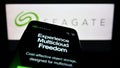 Mobile phone with website of US data storage company Seagate Technology LLC on screen in front of logo. Royalty Free Stock Photo