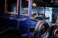 STUTTGART, GERMANY - OCTOBER 16, 2018: Mercedes Museum. Classic blue old vehicle. Side view. Spare wheels on the side