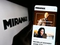 Person holding cellphone with webpage of US television production company Miramax LLC on screen with logo. Royalty Free Stock Photo