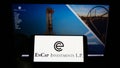 Person holding smartphone with logo of US private equity company EnCap Investments L.P. on screen in front of website. Royalty Free Stock Photo