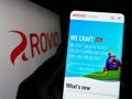 Person holding smartphone with webpage of Finnish games company Rovio Entertainment Oyj on screen with logo. Royalty Free Stock Photo