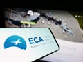 Smartphone with logo of organization European Cockpit Association (ECA) on screen in front of website.