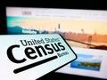 Smartphone with logo of US agency United States Census Bureau (USCB) on screen in front of website.