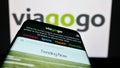 Smartphone with website of US ticket exchange platform company Viagogo on screen in front of business logo.