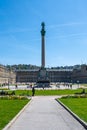 Stuttgart royal palace historic building city centre in spring time with beautiful garden with flower and green grass and blue sky