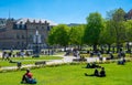 Stuttgart royal palace historic building city centre in spring time with beautiful garden with flower and green grass and blue sky