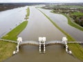 An open weir due to high water level in the Nederrijn river, Holland