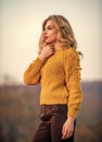 Style is all about balance. Gorgeous lady feeling cozy in woolen sweater. Trendy clothes. Woman warm sweater nature