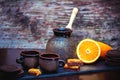 Style ceramic cups, coffee brewing pot, fresh orange and chocolate cookies and candies Royalty Free Stock Photo