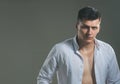 Style and fashion concept. Handsome man with stylish hair. macho in open shirt show fit chest. Guy with serious Royalty Free Stock Photo