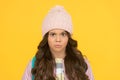 Style guide. Winter hat styles. Kid girl wear knitted hat. Winter accessory concept. Girl long hair yellow background