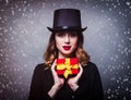 Redhead girl in top hat with gift box Royalty Free Stock Photo