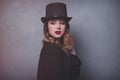 Style and mystique redhead girl in top hat Royalty Free Stock Photo