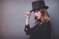 Style and mystique redhead girl in top hat Royalty Free Stock Photo