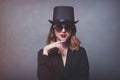 Style and mystique redhead girl in top hat and sunglasses Royalty Free Stock Photo