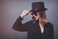 Style and mystique redhead girl in top hat and sunglasses Royalty Free Stock Photo