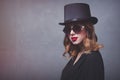 Style and mystique redhead girl in top hat and sunglasses Royalty Free Stock Photo