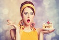 Style redhead girl with cake. Royalty Free Stock Photo