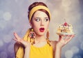 Style redhead girl with cake. Royalty Free Stock Photo