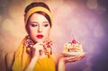 Style redhead girl with cake. Royalty Free Stock Photo