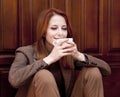 Style redhead girl drinking coffee Royalty Free Stock Photo