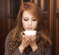 Style redhead girl drinking coffee Royalty Free Stock Photo