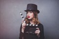 Style redhead girl in top hat with movie clapperboard Royalty Free Stock Photo