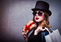 Style redhead girl in top hat with shopping bags and gift box Royalty Free Stock Photo