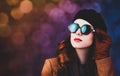 Style redhead woman in sunglasses and coat Royalty Free Stock Photo