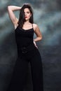 Attractive girl with black hair is posing in studio.  Style, trends, fashion concept. Royalty Free Stock Photo