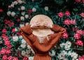 Style woman near rhododendron flowers in a grarden Royalty Free Stock Photo