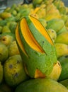 Styled cut mango middle of many mangos