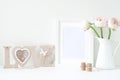 Styled mockup with white frame and pink ranunculos Royalty Free Stock Photo