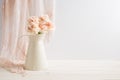 Styled stock image of carnations in a cream jug Royalty Free Stock Photo