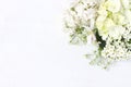 Styled stock photo. Decorative floral composition. Wild wedding or birthday bouquet of blossoming white lilac, apple