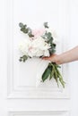 Styled stock photo. Feminine wedding, birthday composition. Closeup of woman`s hands holding peonies flowers and
